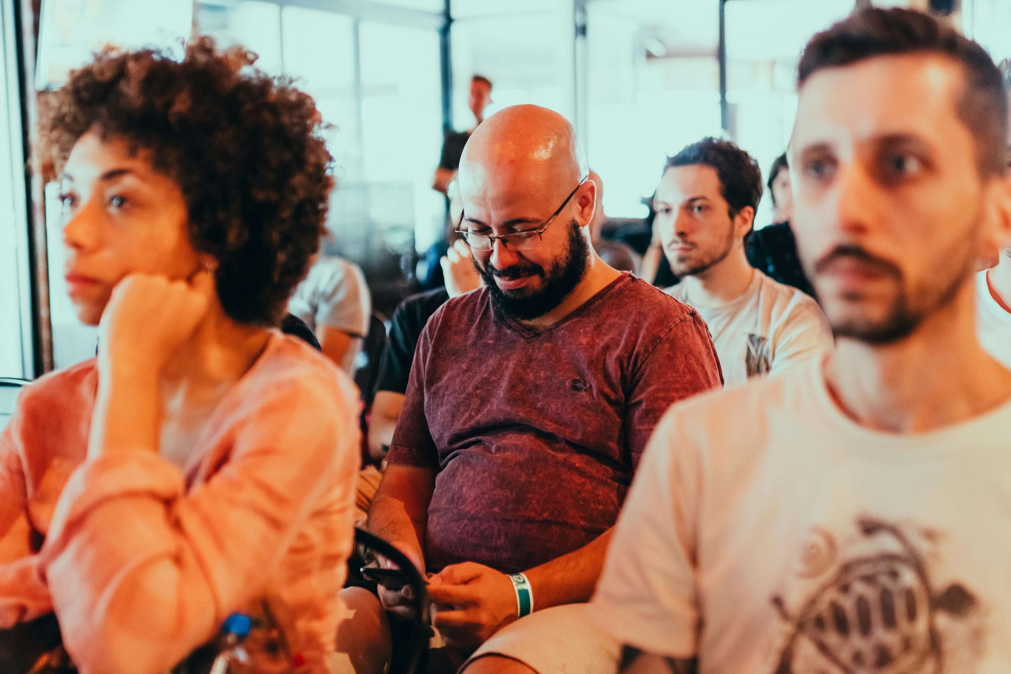 Attendees listening at a community conference